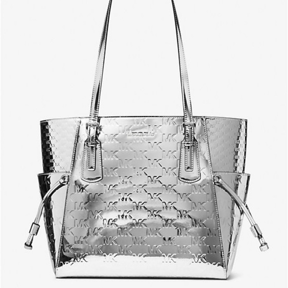 Michael Kors Handbags - MICHAEL KORS Voyager Large Patent Logo Debossed EW Shoulder Tote Bag
Silver NWT